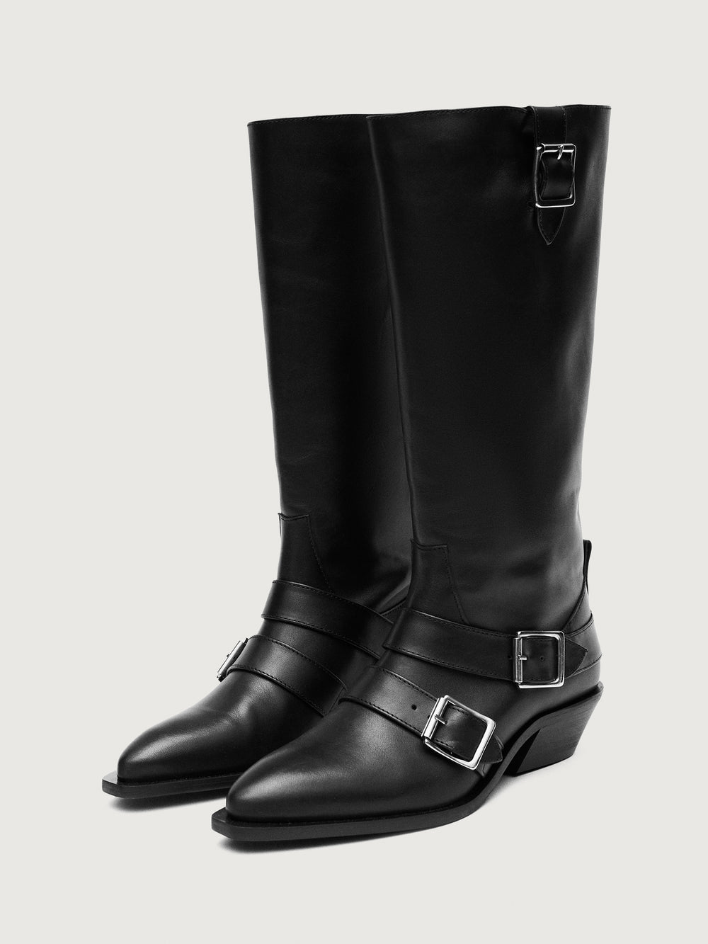 Black knee-high boot with silver buckles.