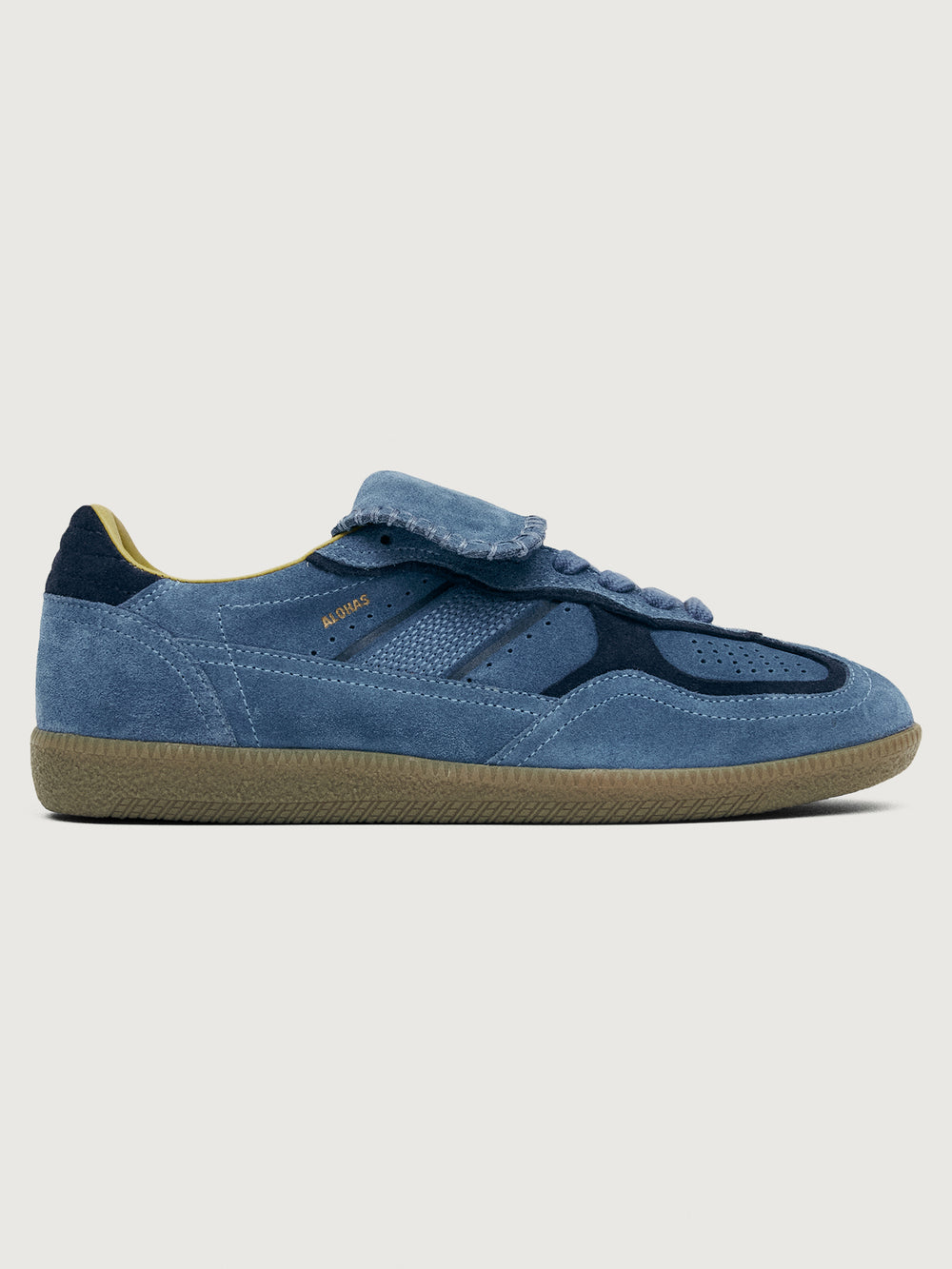 Denim blue suede low top lifestyle sneaker with navy heel detailing. 