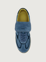 Denim blue suede low top lifestyle sneaker with navy heel detailing. 