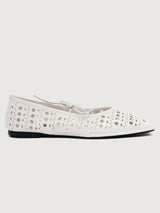White flat shoe with cut-out design.