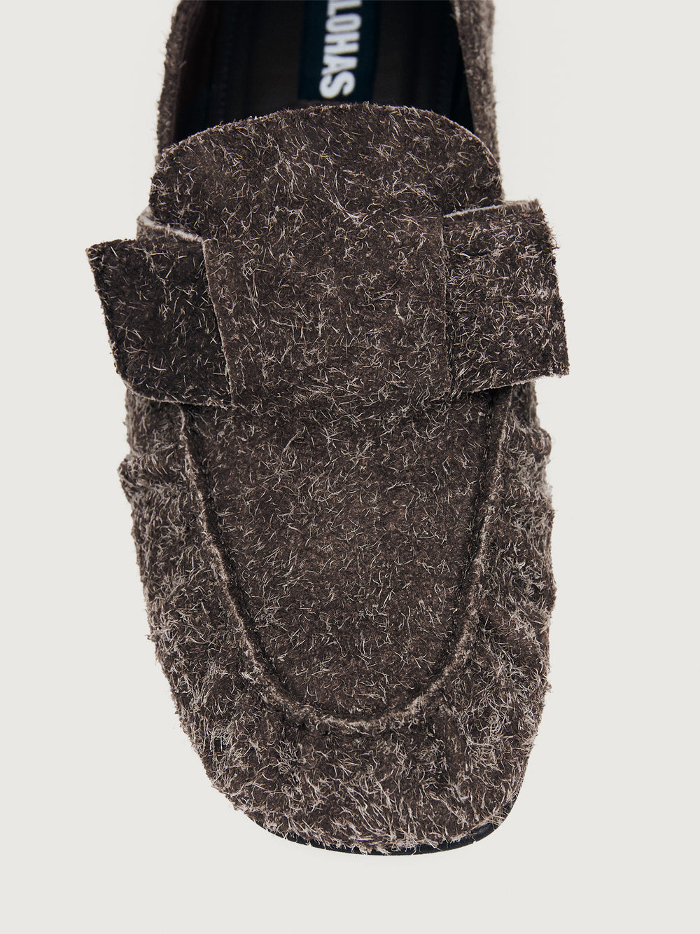 Brown suede loafer shoe.