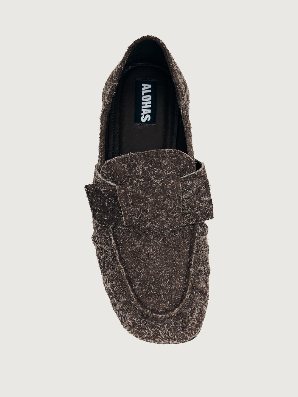 Brown suede loafer shoe.