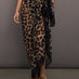 Model wears leopard print skirt with a long, flowy silhouette and a tie closure at the waist.




