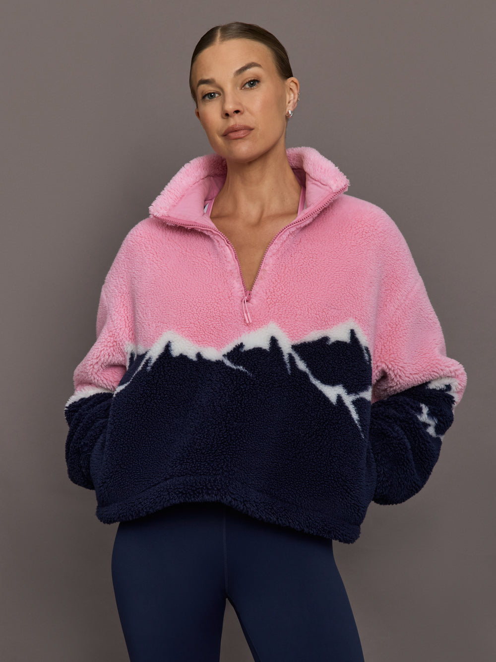 Model wearing Lenoa Sherpa Top in Snowy Peaks, front view with half-zip collar.