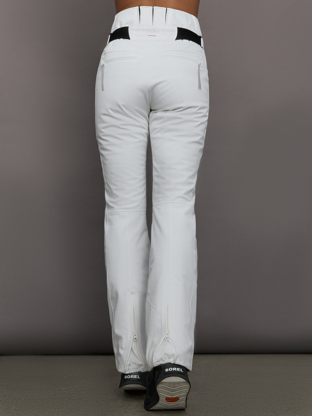 White pants with black accents on a gray background