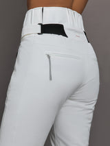 White ski pants with a black belt and zipper on a gray background