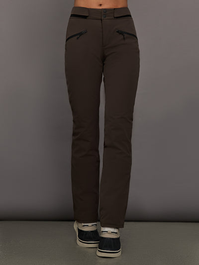 Brown pants worn by a person on a gray background
