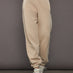 Front view of model wearing ILMI Sweatpants Dune with elastic cuff and relaxed fit.