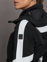 Black jacket with white accents and a brand logo on a gray background