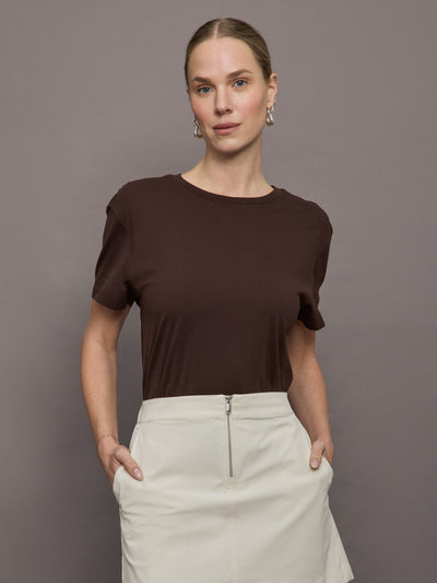 Model wears a basic dark brown tee shirt with ringer neck and the word "Bandier" across the sleeve. 