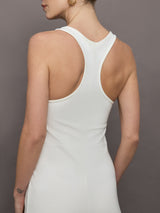 Model wears a white wide leg jumpsuit. 