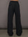 Model wears a pair of black mid-rise wide leg cargo pants with cargo pockets on side, silver zipper in front. 