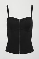 A black tank top with corseted silhouette and silver zipper extending from top to bottom in center. 