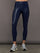 Model wears liquid takara shine leggings in regular rise with a thick waistband in navy.
