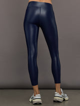 Model wears liquid takara shine leggings in regular rise with a thick waistband in navy.
