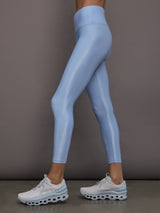 Model is wearing the High Rise 7/8 Legging in Takara Shine in Serenity shown from the side.