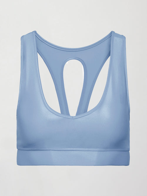 Flat lay of the Action Bra 2.0 in Takara Shine in Serenity showing racerback cutout construction.