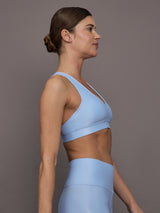 Model is wearing the Action Bra 2.0 in Takara Shine in Serenity shown from the side.