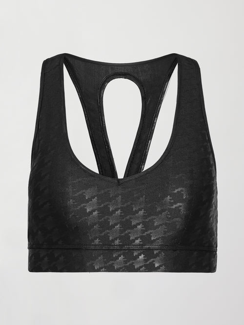 Image of a vneck black bra with a shiny houndstooth all over print. 