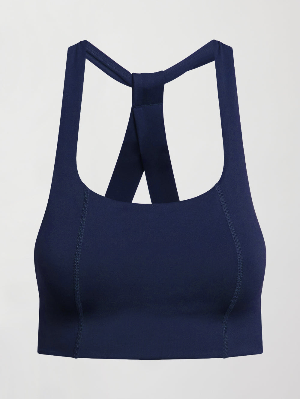 Flat lay of navy compression T Back sports bra on white background.