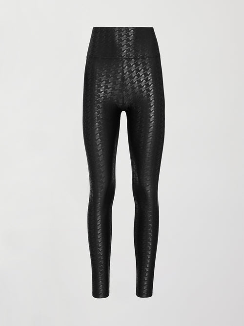 Image shows a pair of high waisted black houndstooth print leggings. 