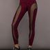 Model is wearing Melt sheer spliced leggings in red leopard, front view.