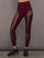 Model is wearing Melt sheer spliced leggings in red leopard, front view.