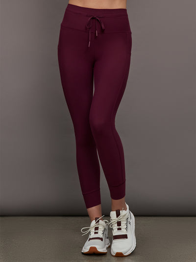 Model wearing Fig colored leggings with a high waist and pockets