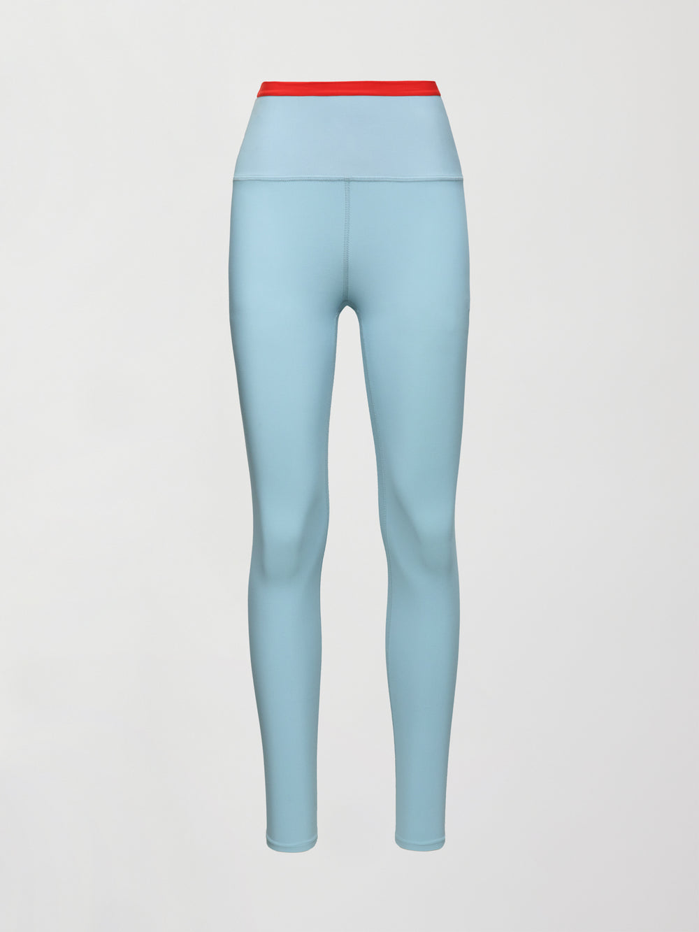 A light blue performance legging with a red waistline. 