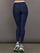 Model wears a buttery soft high waisted navy legging with thin white waistband. 