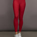 Model is wearing Melt Contrast Waistband Legging in Cherry Red/White, front view.