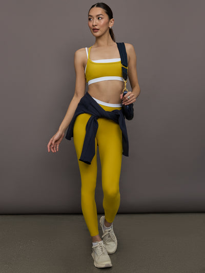 Model is wearing Melt contrast waistband legging in Mango Mint/White, full body view.