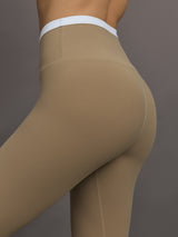 Model wears a buttery soft high waisted chinchilla legging with thin white waistband. 