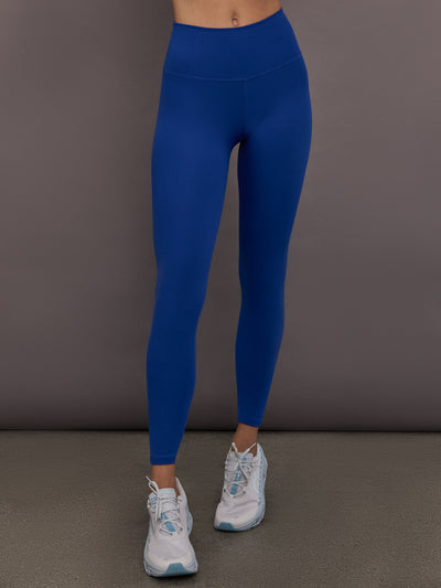 Model is wearing Rib Melt High-Rise Legging in Cobalt, front view.