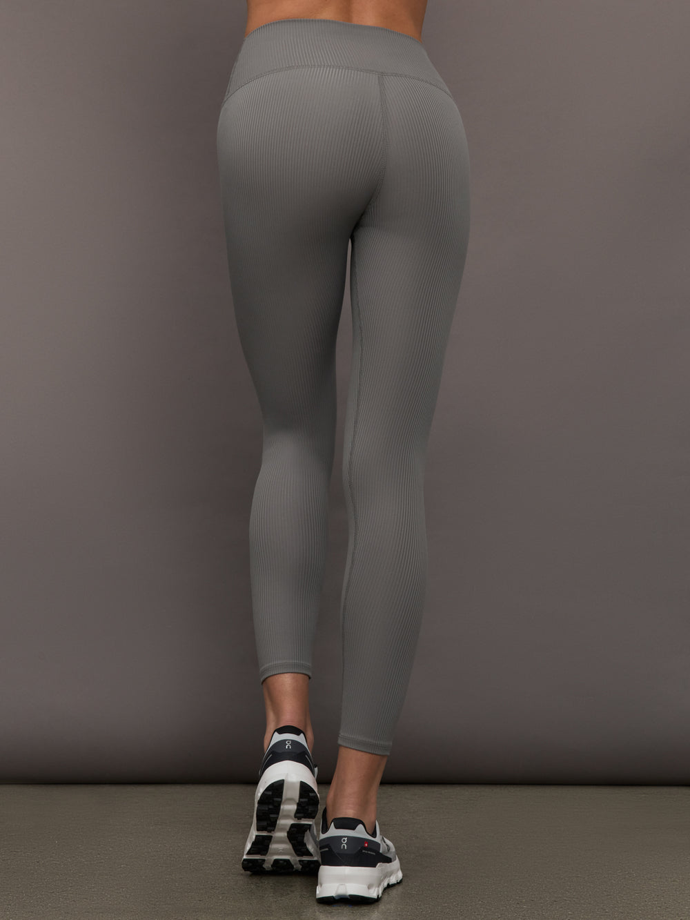 Back view of Ribbed Melt High Rise Legging in Steel Grey on model.
