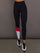 Model is wearing Melt high-rise colorblock legging in black crimson white, front view.