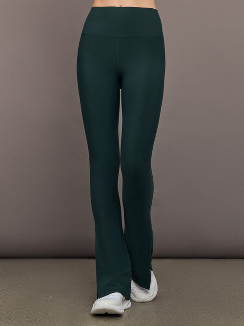 Model is wearing the Split Bootcut Legging in Forest, front view.