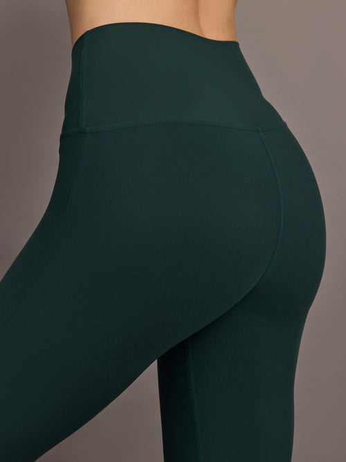 Close up of the Split Bootcut Legging in Forest, waistband and hip detail.