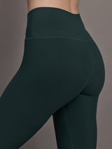 Close up of the High Rise Legging in Forest, waistband and hip detail.
