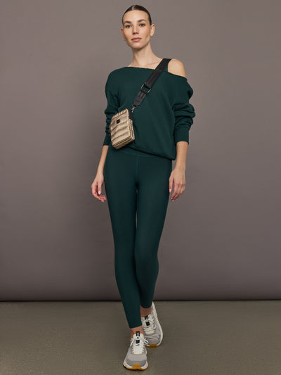 Model is wearing the High Rise Legging in Forest, full body view.