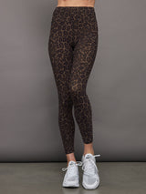 Model wears high waisted brown leopard print leggings. 