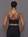 Back view of Melt Strappy Bra in Black on model showing crisscross straps.