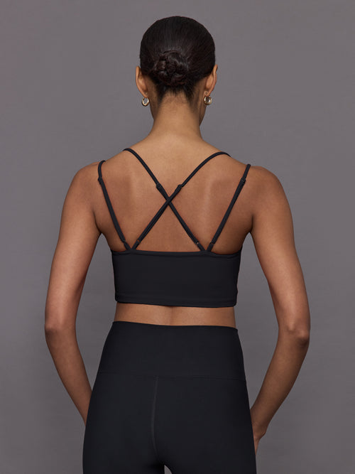 Back view of Melt Strappy Bra in Black on model showing crisscross straps.