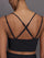 Close-up of Melt Strappy Bra in Black with strappy back detail.