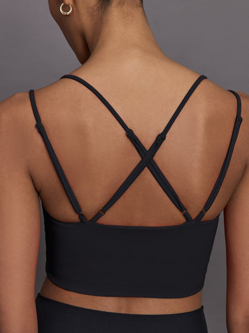 Close-up of Melt Strappy Bra in Black with strappy back detail.