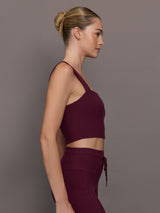 Model wearing a fig bra top with a square neck