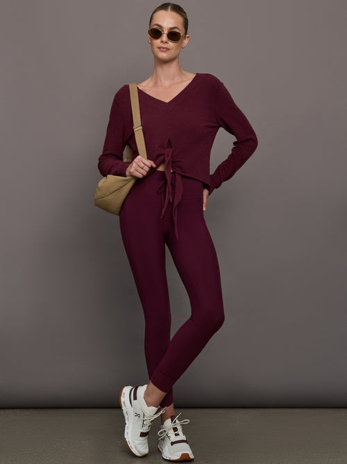 Model wearing a fig bra top with a square neck