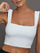 Close-up of Square Neck Bra Top in White square neckline and strap detail.