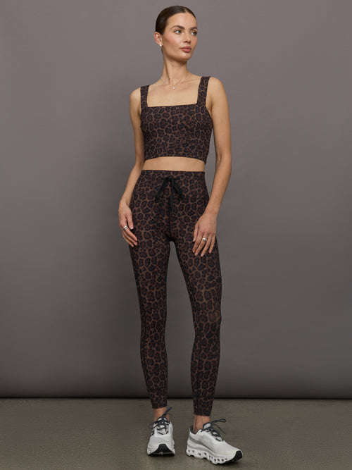 Full outfit styled with Melt Square Neck Bra Leopard Print and leggings front view.