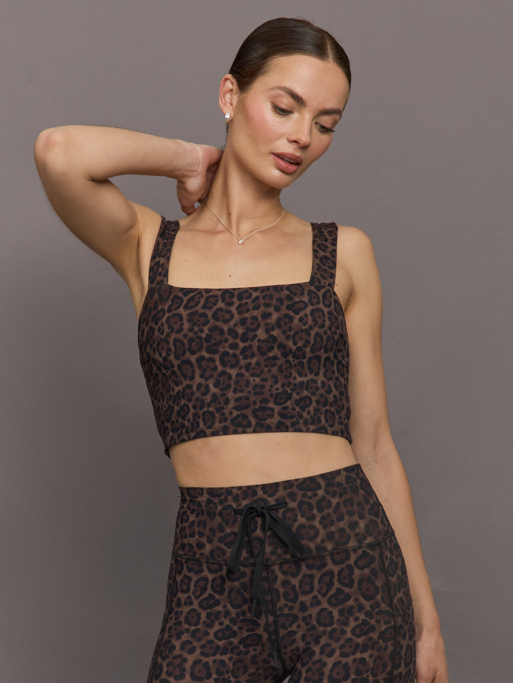 Model wearing Melt Square Neck Bra Leopard Print cropped front view.